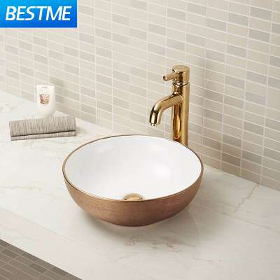 Washroom ceramic sink in Oval shape with customized gold/white color